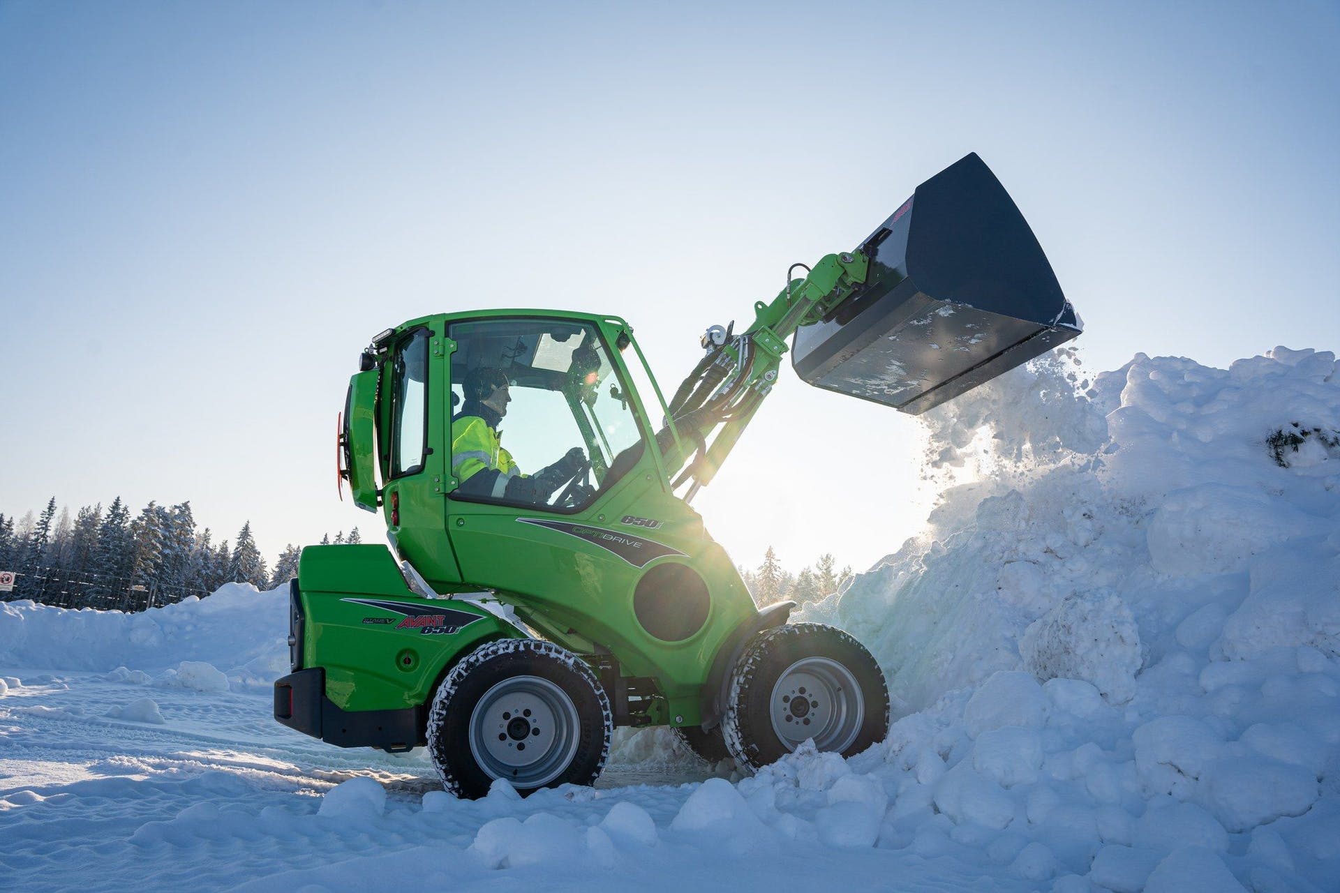 Avant Tecno new 650i compact wheel loader shoveling snow