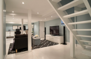 downstairs-living-room-with-stairs-jeffery-and-wilkes-basement-refurbishment