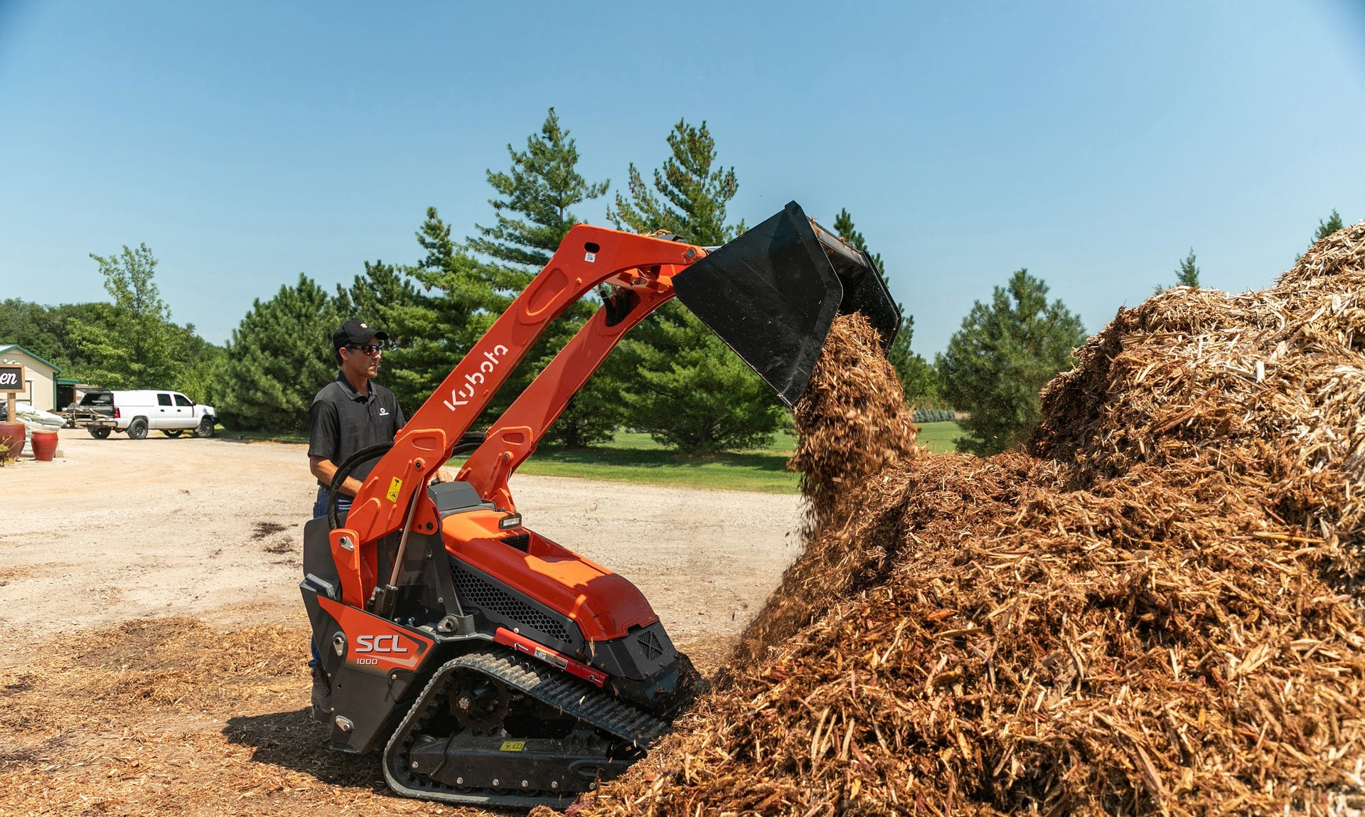 Kubota incorporated many design elements of its compact track loaders in developing its first CUL, the SCL1000. Controls are pilot operated. Standard features include keyless start with passcode protection, 12-volt charging port and a 4.3-inch LCD color dash monitor. Push-button control of auxiliary hydraulics is built into the loader control handle. Cushioned loader boom cylinders and an adjustable platform suspension system enhance operator comfort.