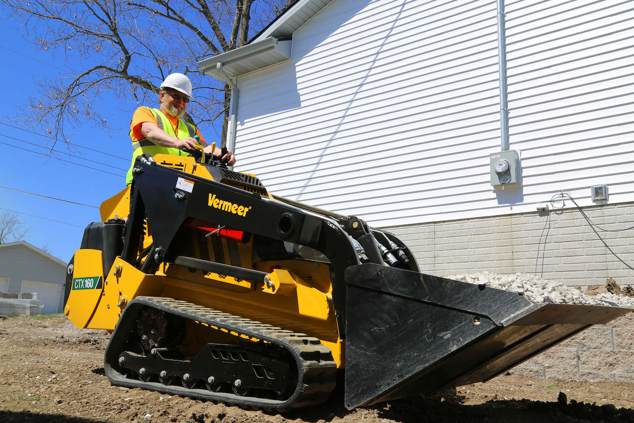 The Vermeer CTX160 is powered by a Kohler diesel engine rated at 40 horsepower. The dual hydraulic system provides up to 16.7 gpm of auxiliary flow at 3,045 psi of pressure. Operating weight with the standard bucket is 4,120 pounds, and rated lift capacity is 1,600 pounds. Hinge pin height is 88.8 inches. Machine dimensions are 59 inches high, 42 inches wide (with 9-inch tracks) and 116 inches long (with the standard bucket).