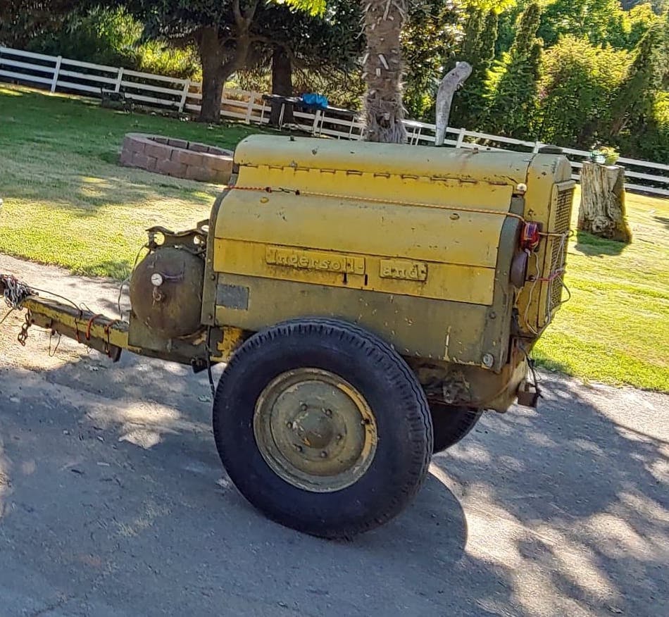 faded yellow 1943 Ingersoll-Rand air compressor before being restored